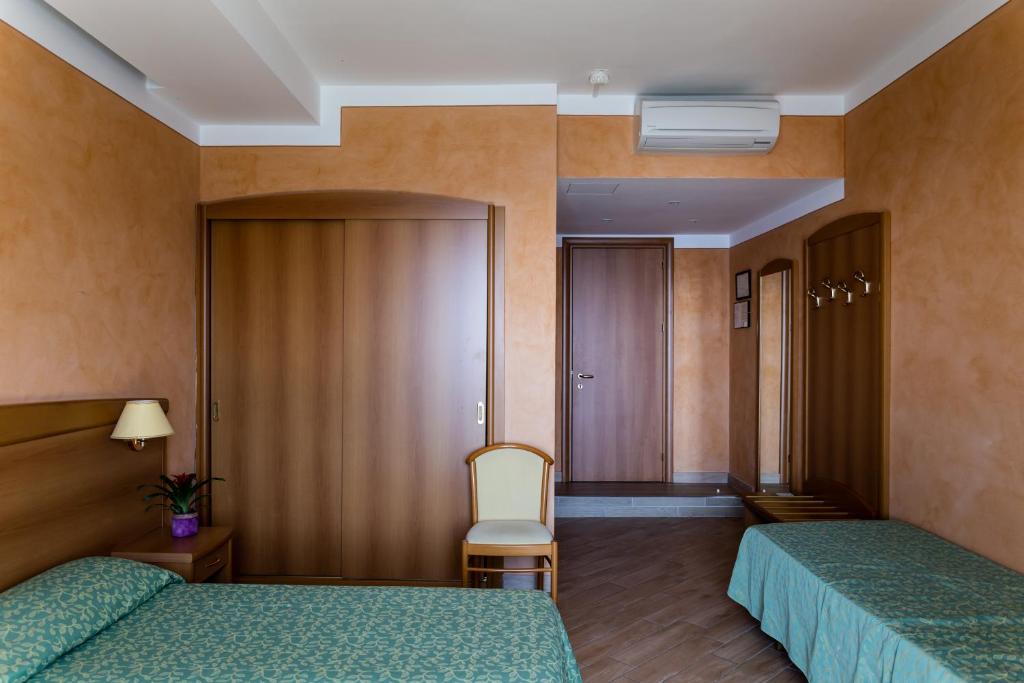 Łóżko lub łóżka w pokoju w obiekcie Park Hotel Zanzanù