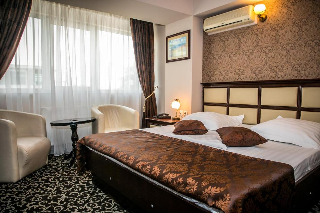 Postel nebo postele na pokoji v ubytování Hotel Megalos