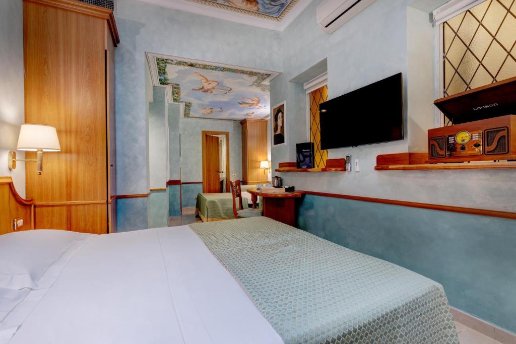 TV a/nebo společenská místnost v ubytování Hotel Amalfi