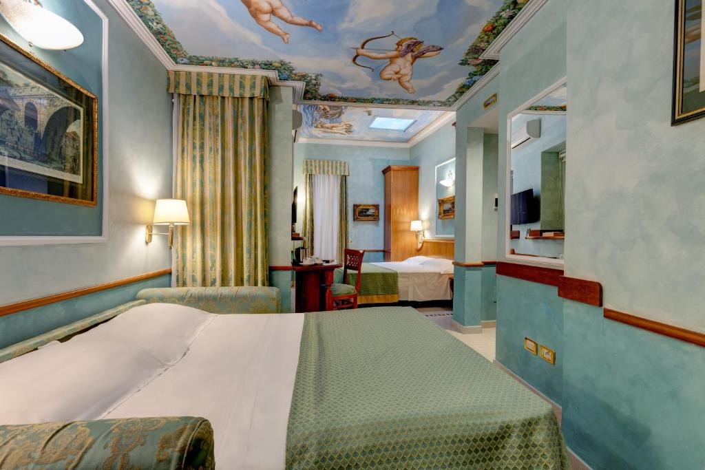 Postel nebo postele na pokoji v ubytování Hotel Amalfi