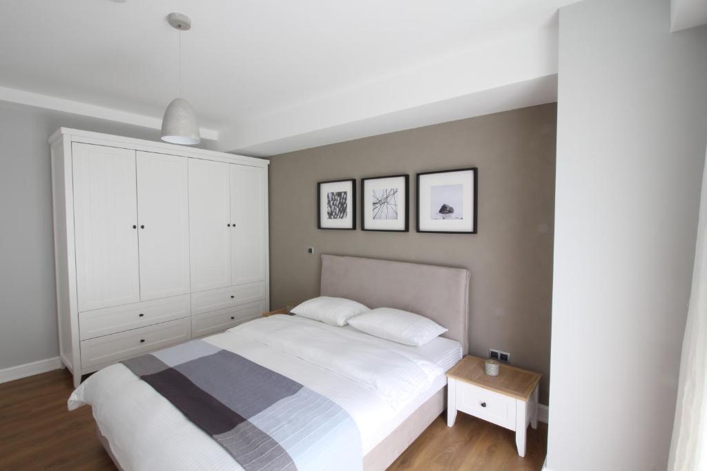 Postel nebo postele na pokoji v ubytování Elia Apartments