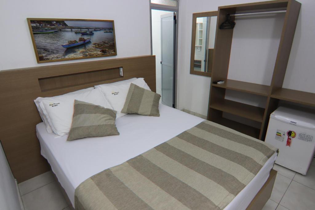 Postel nebo postele na pokoji v ubytování Hotel Dom Passos