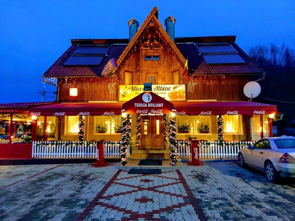 a building with solar panels on top of it at Aterman House in Vlădeni