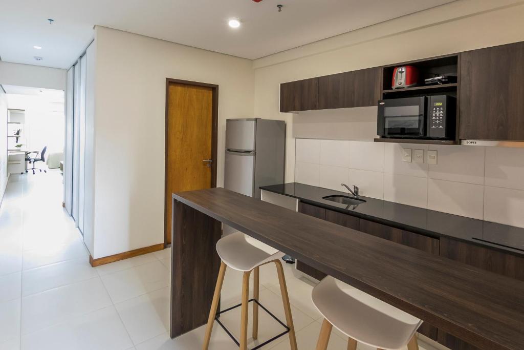 Kuchyň nebo kuchyňský kout v ubytování Asuncion Rent Suites Centro