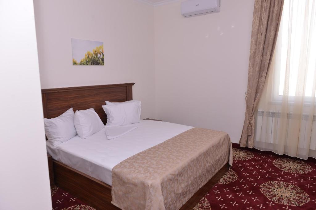 Postel nebo postele na pokoji v ubytování Georgia Hotel