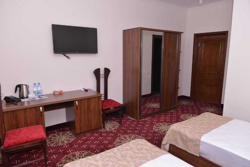Postel nebo postele na pokoji v ubytování Georgia Hotel