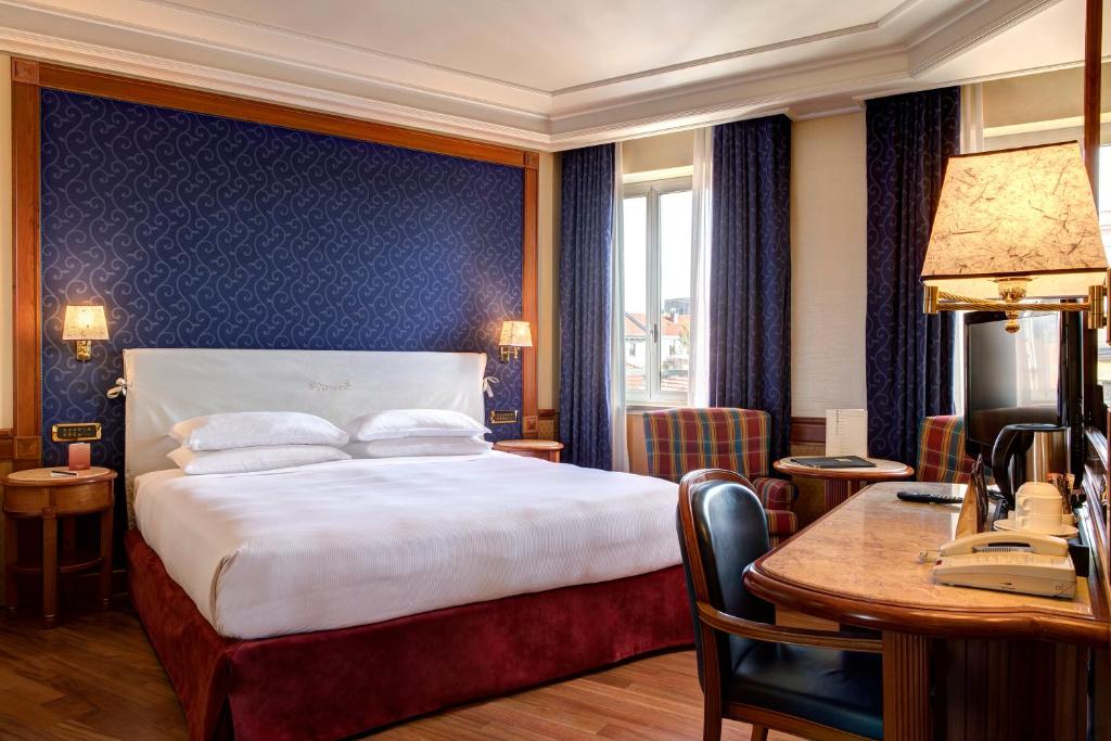 Posteľ alebo postele v izbe v ubytovaní Hotel Capitol Milano