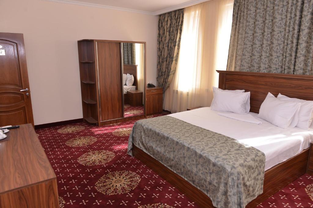 Postel nebo postele na pokoji v ubytování Georgia Hotel