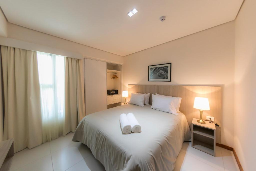 Postel nebo postele na pokoji v ubytování Asuncion Rent Suites Centro
