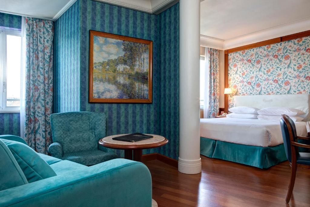Posteľ alebo postele v izbe v ubytovaní Hotel Capitol Milano