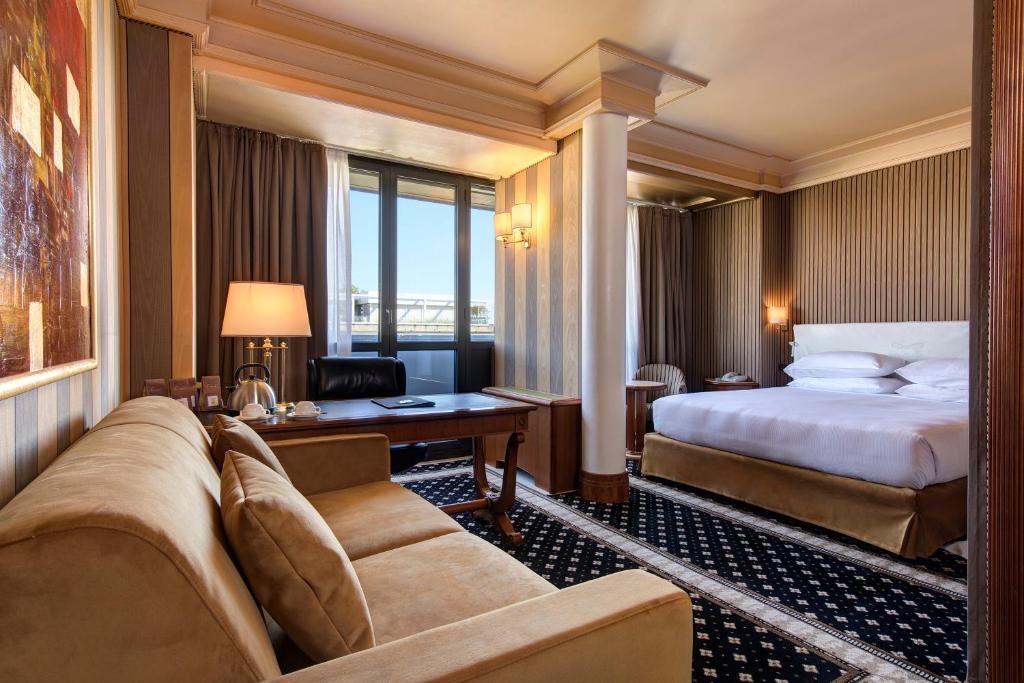 Posteľ alebo postele v izbe v ubytovaní Hotel Capitol Milano