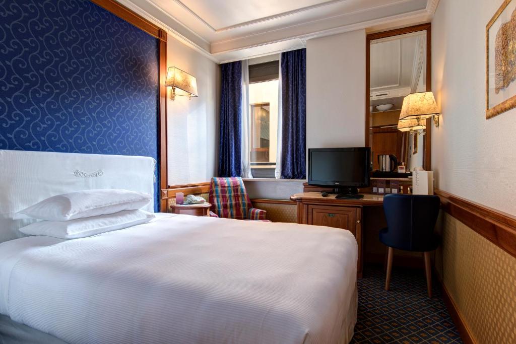 Posteľ alebo postele v izbe v ubytovaní Hotel Capitol Milano