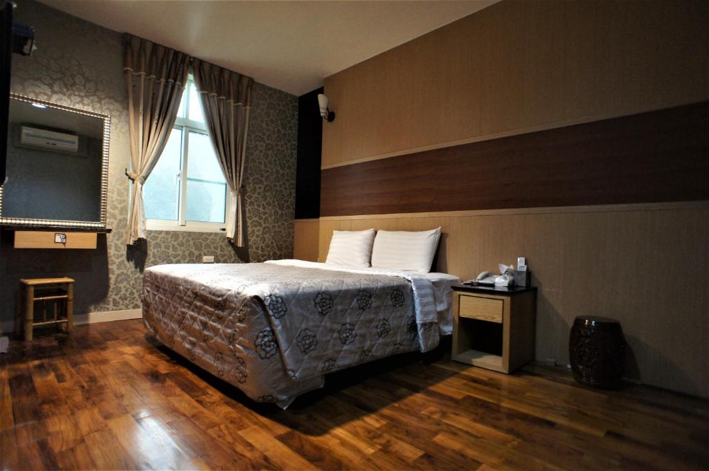 Postel nebo postele na pokoji v ubytování Xi Xin Guan Hot Spring Resort