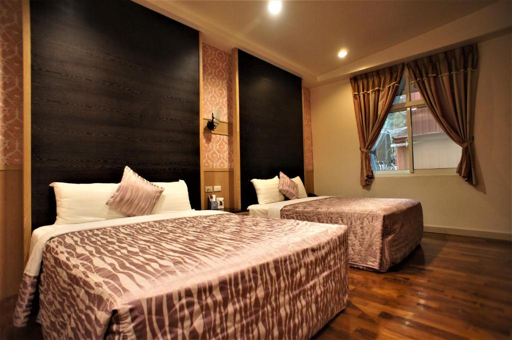 Postel nebo postele na pokoji v ubytování Xi Xin Guan Hot Spring Resort