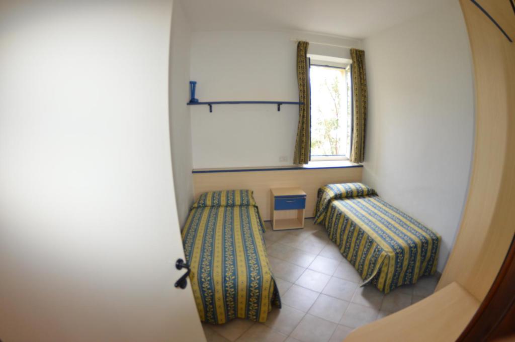 Postel nebo postele na pokoji v ubytování Residence Villa Miky