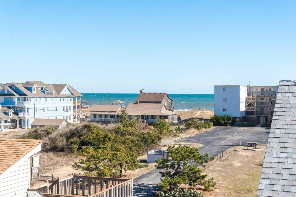 a view of the beach from the roof of a building at Boss's Playhouse in Kill Devil Hills