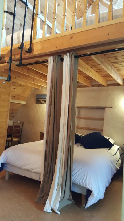 Postel nebo postele na pokoji v ubytování Le Marite
