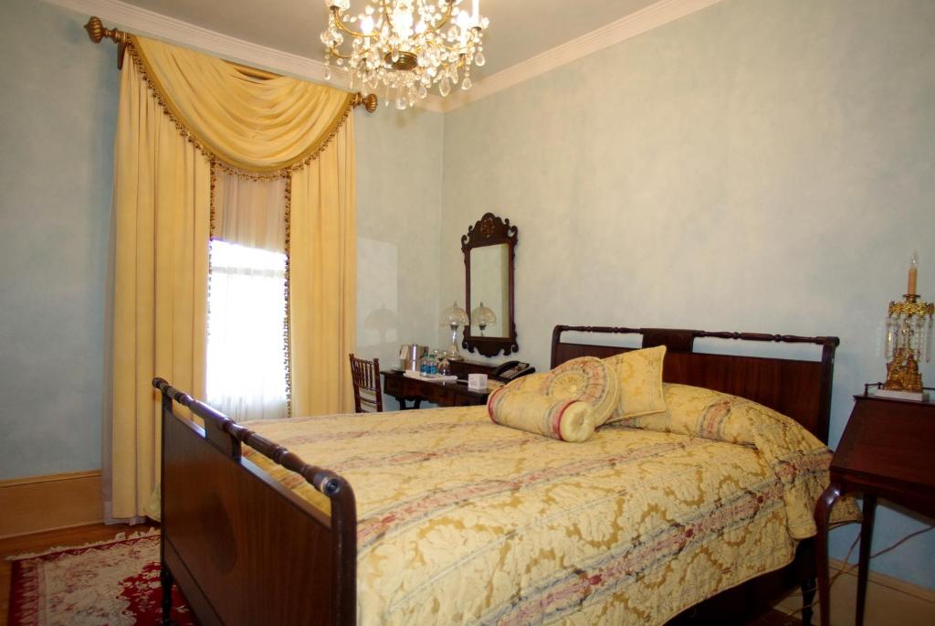 Postel nebo postele na pokoji v ubytování The Hotel Magnolia
