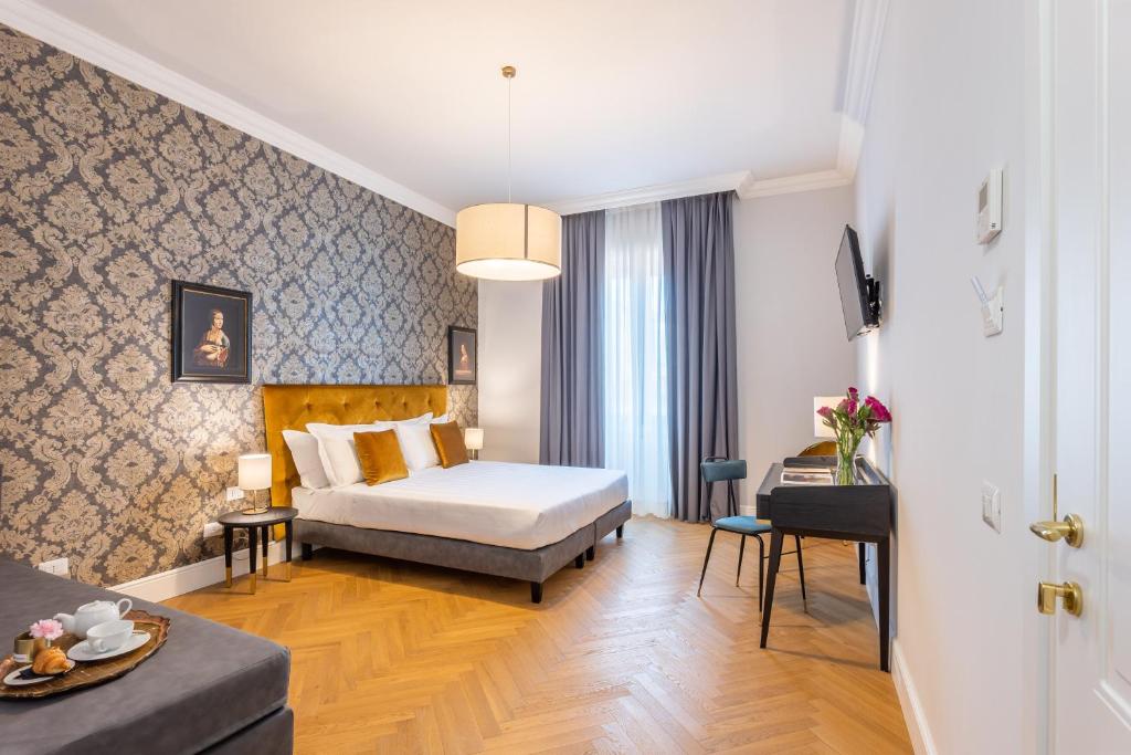 Postel nebo postele na pokoji v ubytování 3110 ArtHotel