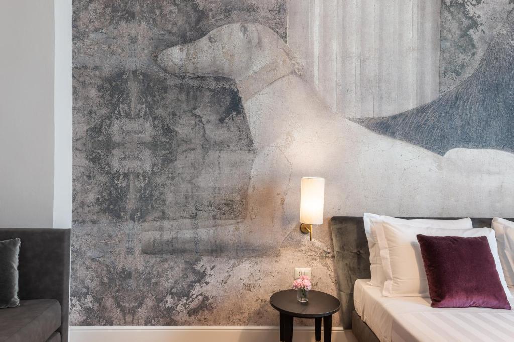 Postel nebo postele na pokoji v ubytování 3110 ArtHotel