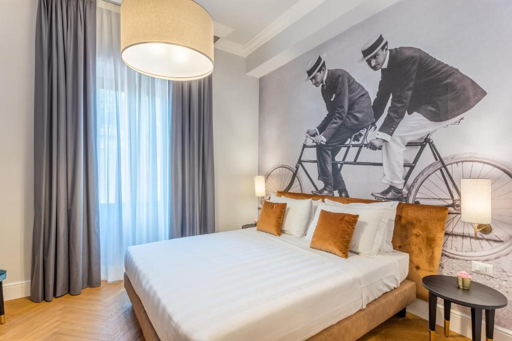Postel nebo postele na pokoji v ubytování 3110 ArtHotel