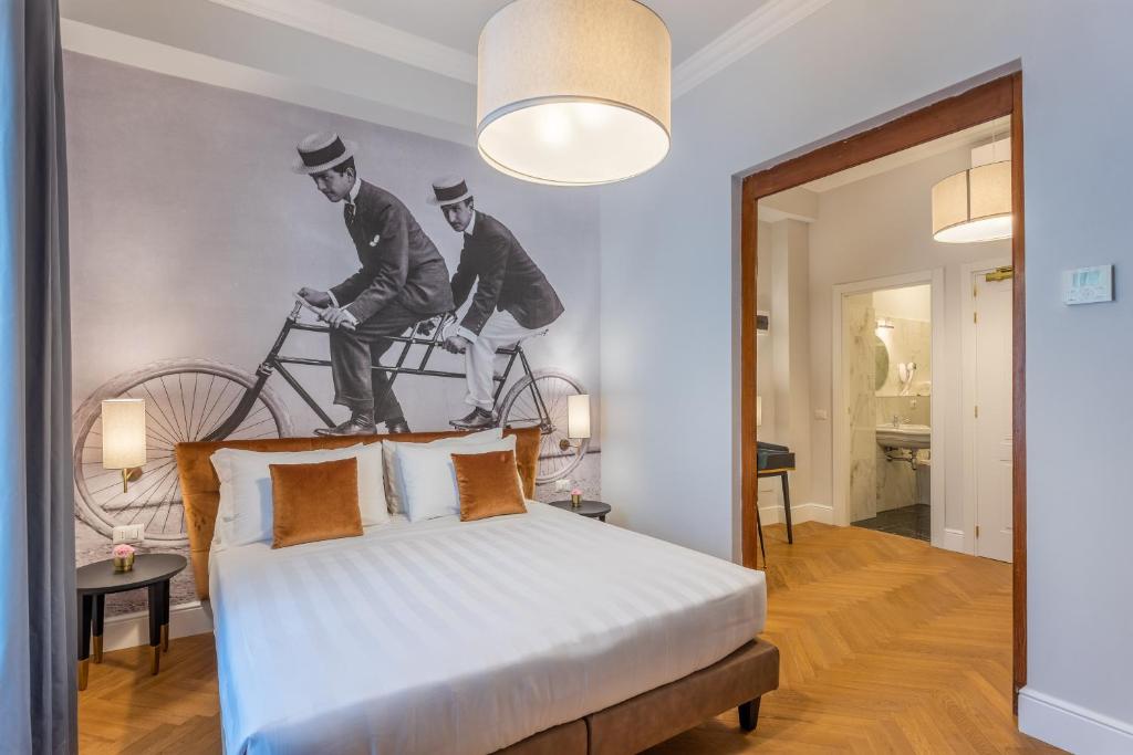 Postel nebo postele na pokoji v ubytování 3110 ArtHotel