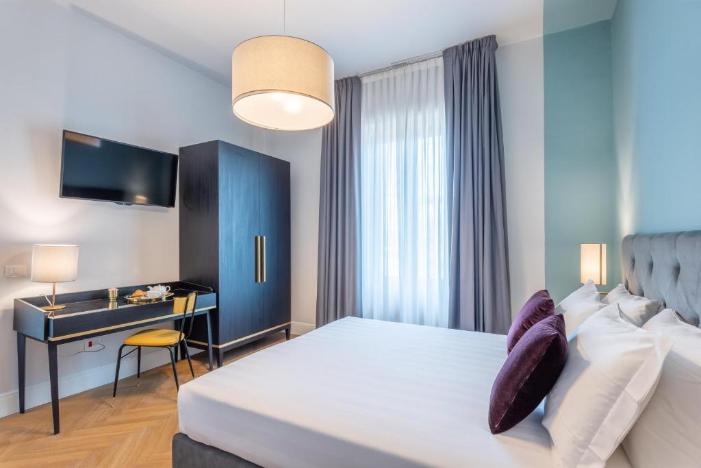 Postel nebo postele na pokoji v ubytování 3110 ArtHotel