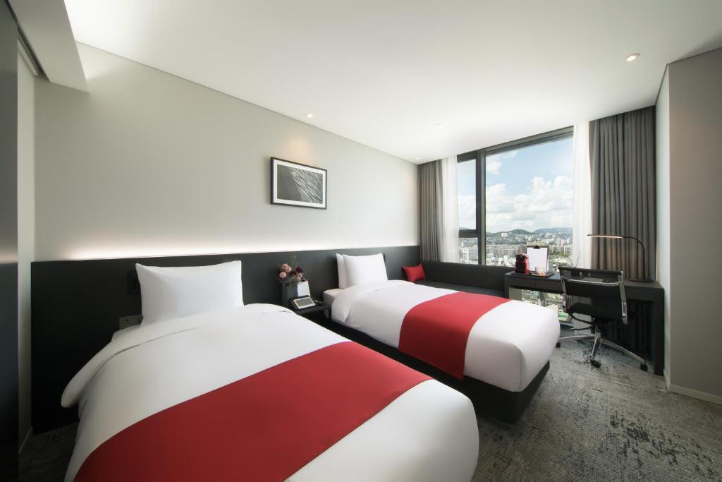 Posteľ alebo postele v izbe v ubytovaní Aiden by Best Western Cheongdam