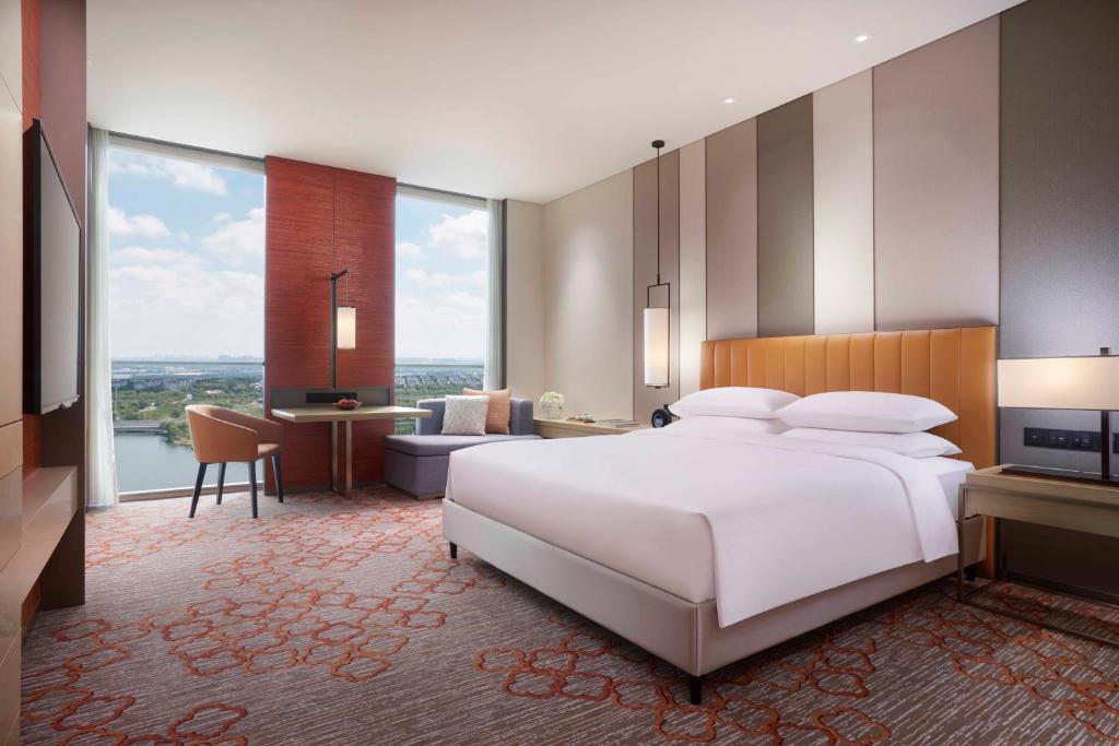 Postel nebo postele na pokoji v ubytování Hyatt Regency Shanghai Jiading