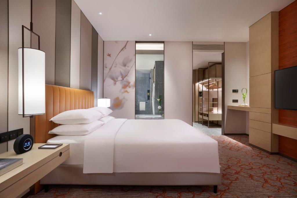 Postel nebo postele na pokoji v ubytování Hyatt Regency Shanghai Jiading