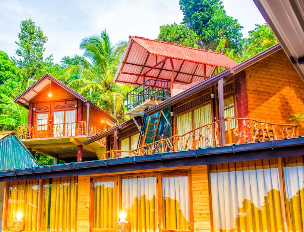 a row of cottages in a resort at Ella City Reach Hostel in Ella