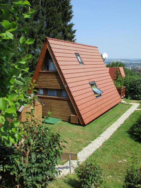 a house with a red roof on a hill at Auf die 12 - Auf die 13 in Freyung