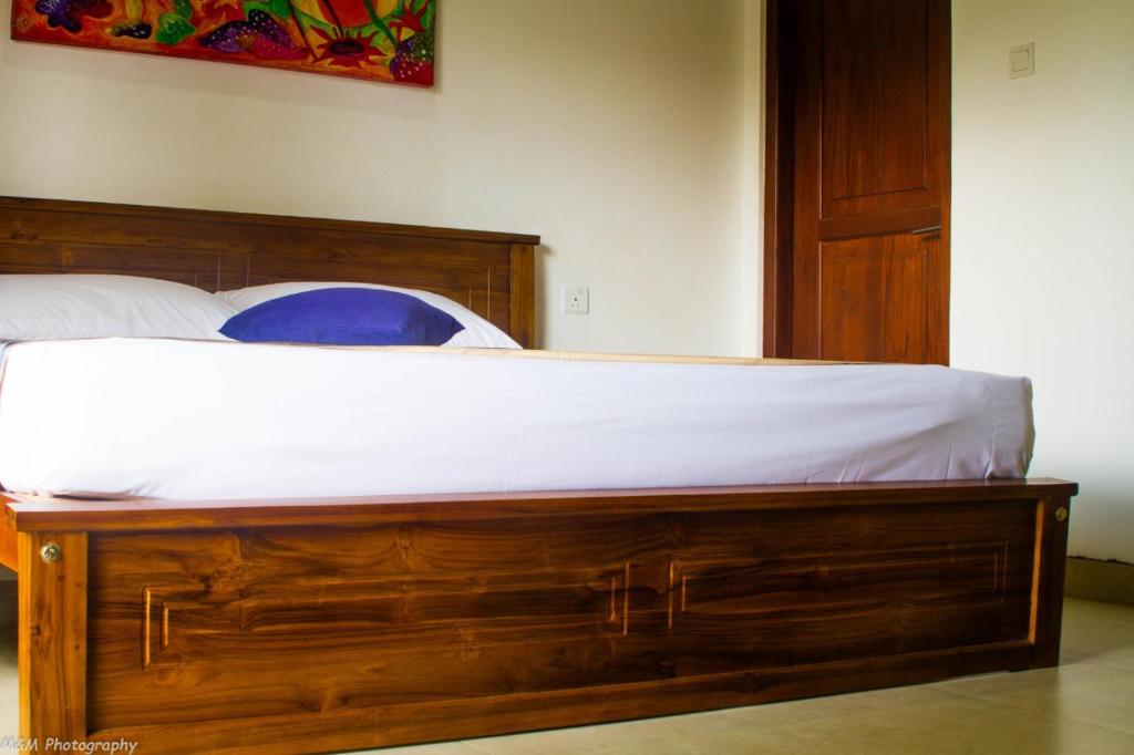 Postel nebo postele na pokoji v ubytování Volunteer Ceylon