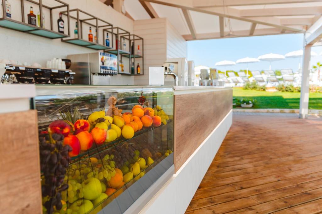 a display of fruits and vegetables in a grocery store at Torre Cintola Greenblu Sea Emotions in Monopoli