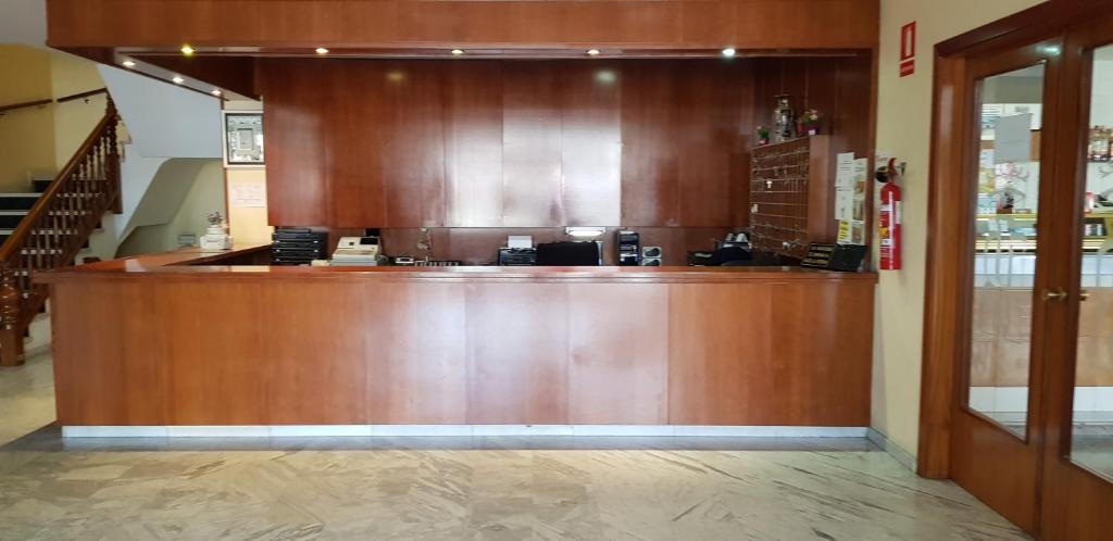 a large wooden counter in a store at Hotel Reina Isabel in Lleida
