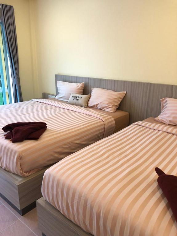Postel nebo postele na pokoji v ubytování Chokdee Resort