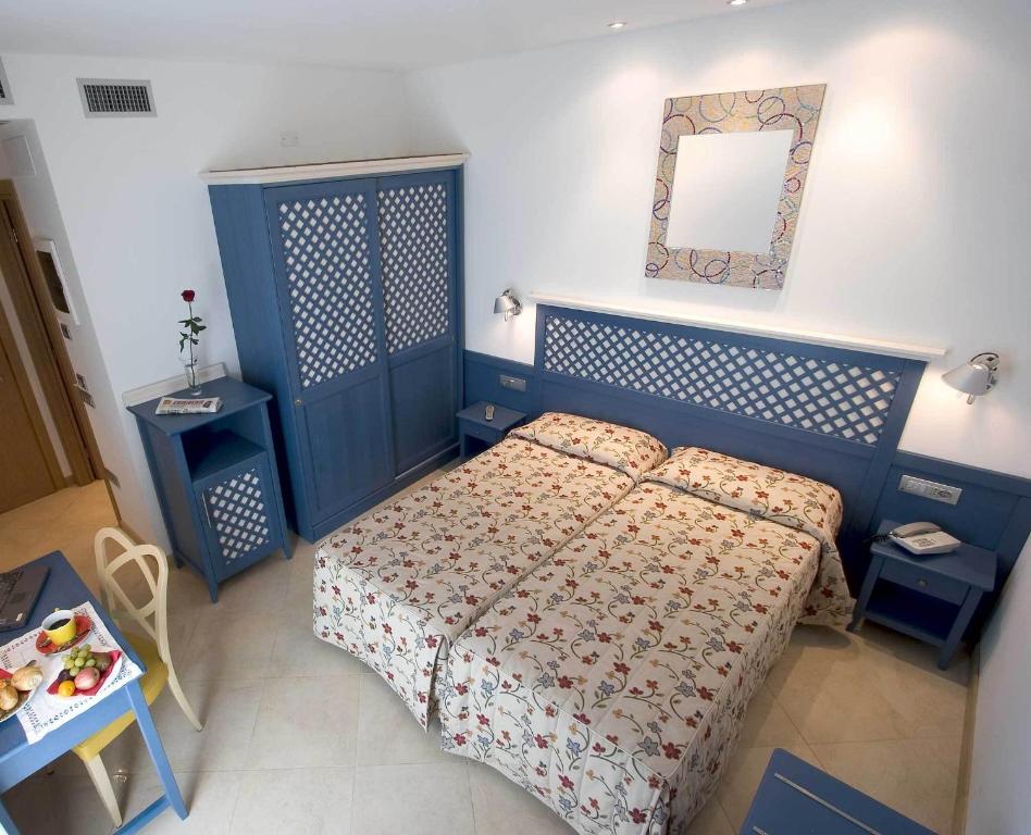 Postel nebo postele na pokoji v ubytování Hotel Katja