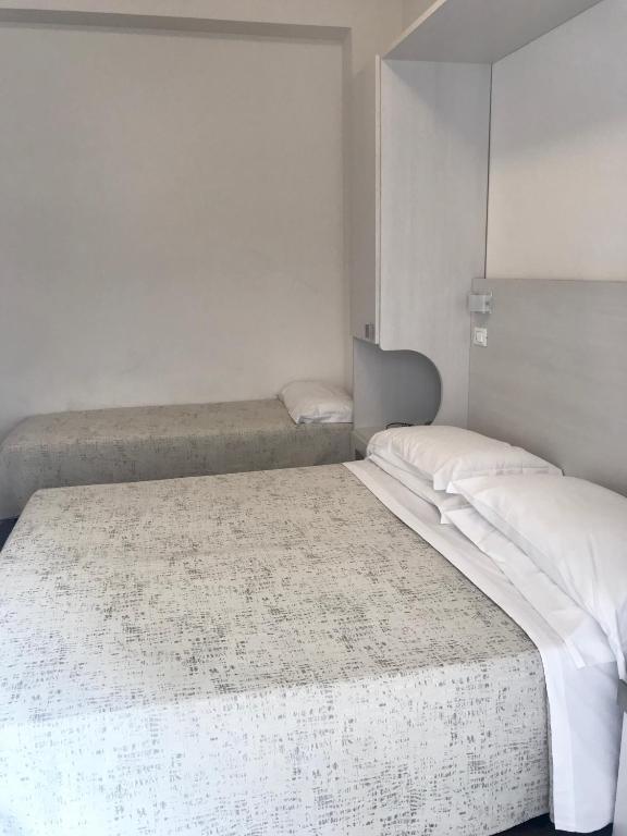 Postel nebo postele na pokoji v ubytování Hotel Nelson