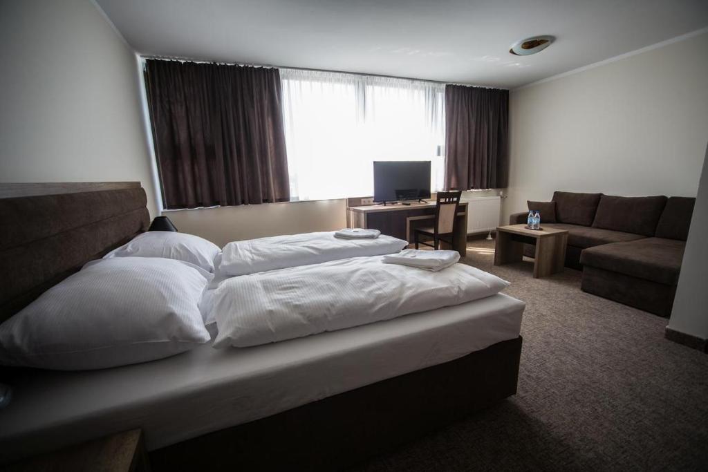 Postel nebo postele na pokoji v ubytování Hotel Cargo