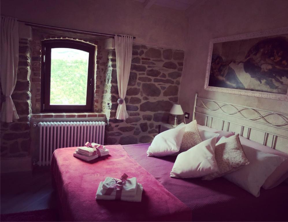 Postel nebo postele na pokoji v ubytování Iris Country House