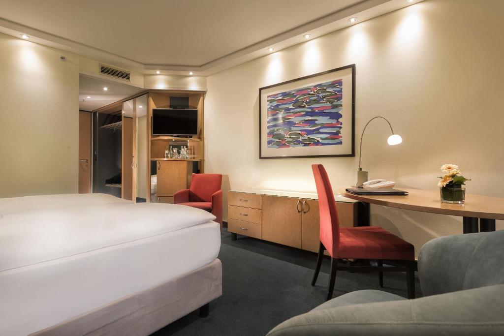 Кровать или кровати в номере Maritim proArte Hotel Berlin