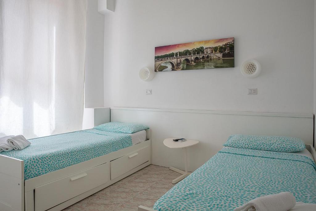 Postel nebo postele na pokoji v ubytování Hotel Castelfidardo