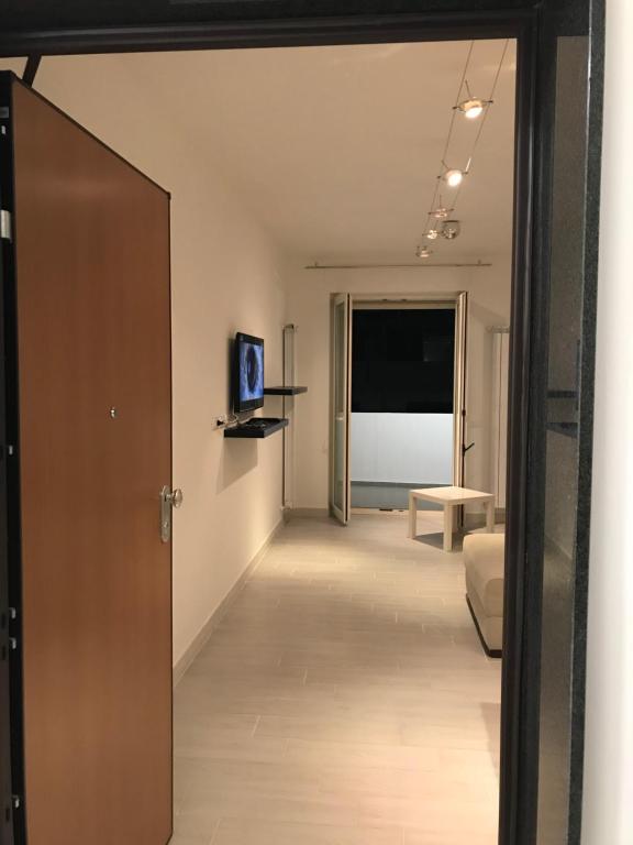 a hallway with a door leading to a living room at Bari Lory’s Home in Bari
