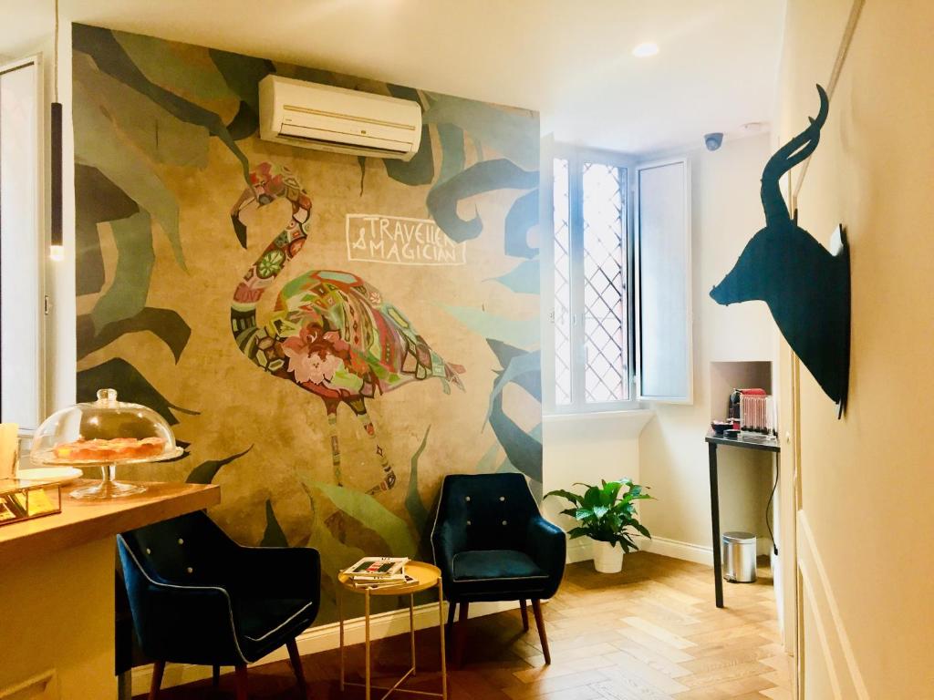 Televízia a/alebo spoločenská miestnosť v ubytovaní Palazzo Baj in Trastevere