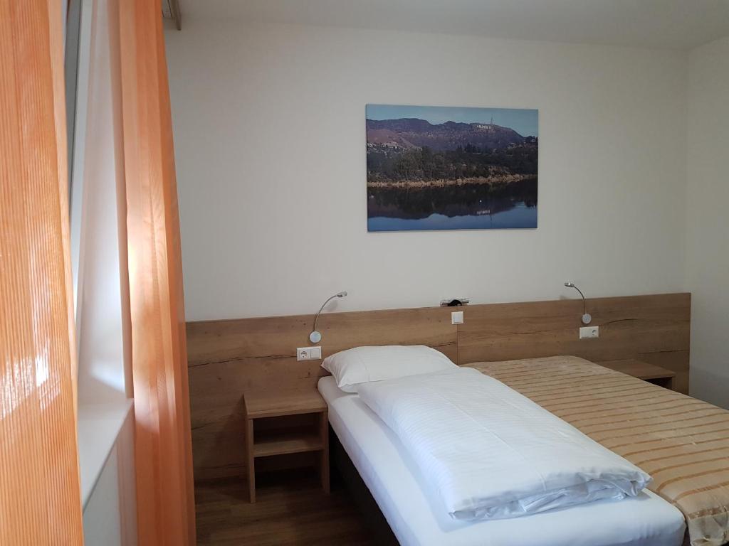 Posteľ alebo postele v izbe v ubytovaní Hotel Rimo