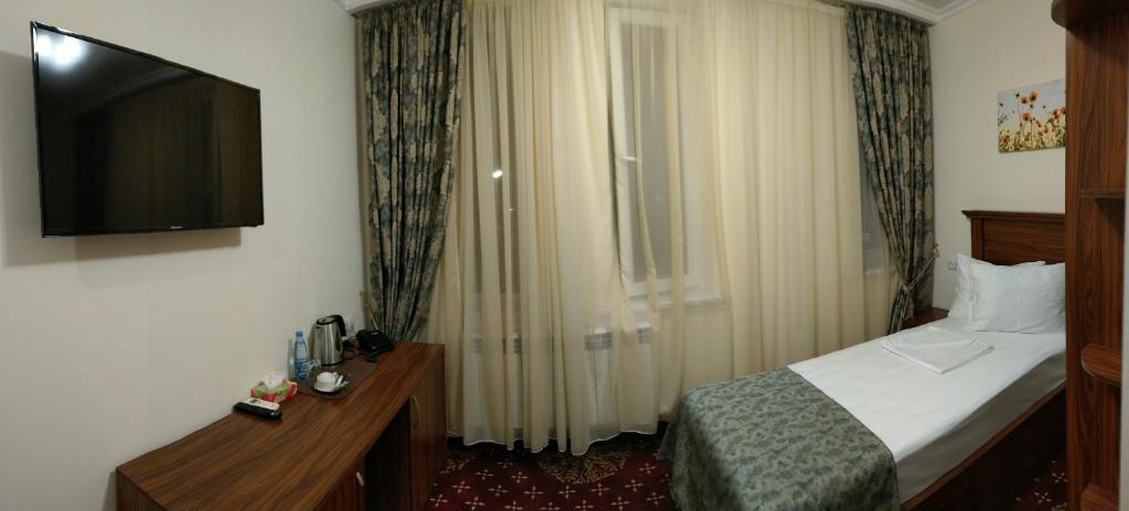 Postel nebo postele na pokoji v ubytování Georgia Hotel