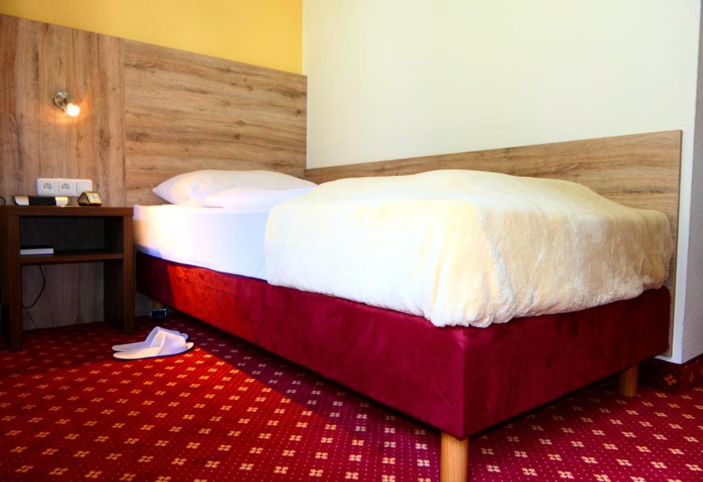 Postel nebo postele na pokoji v ubytování Hotel Christel