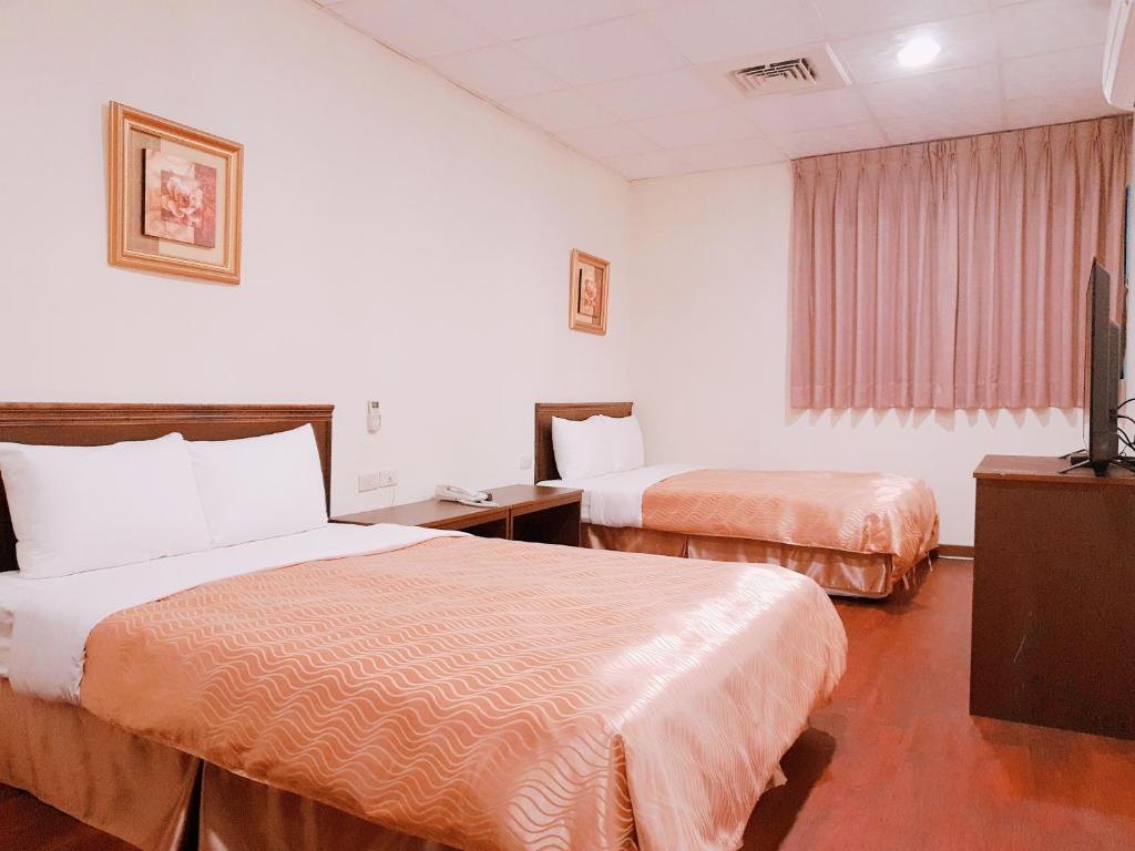 Ένα ή περισσότερα κρεβάτια σε δωμάτιο στο Blue Ocean Hotel