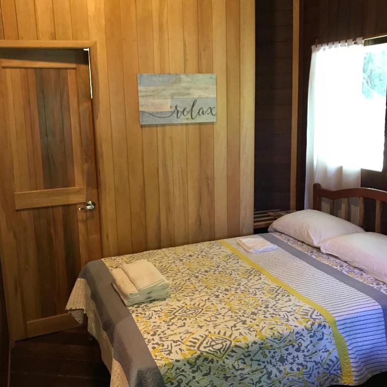 Postel nebo postele na pokoji v ubytování Hilamito Lodge
