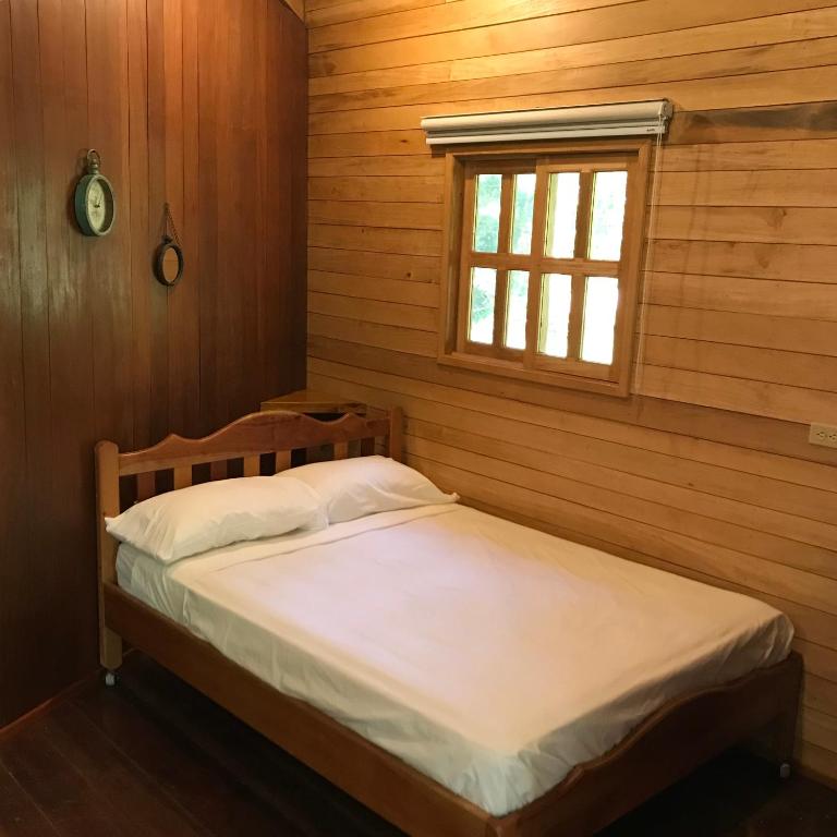 Postel nebo postele na pokoji v ubytování Hilamito Lodge